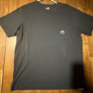 KAWS Black Tee with Blue Pocket Detail
